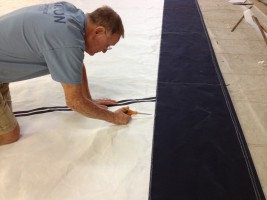 Black and yellow sail on the floor of the loft