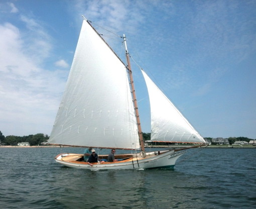 Gaff rigged sloop with white Linthicum sails